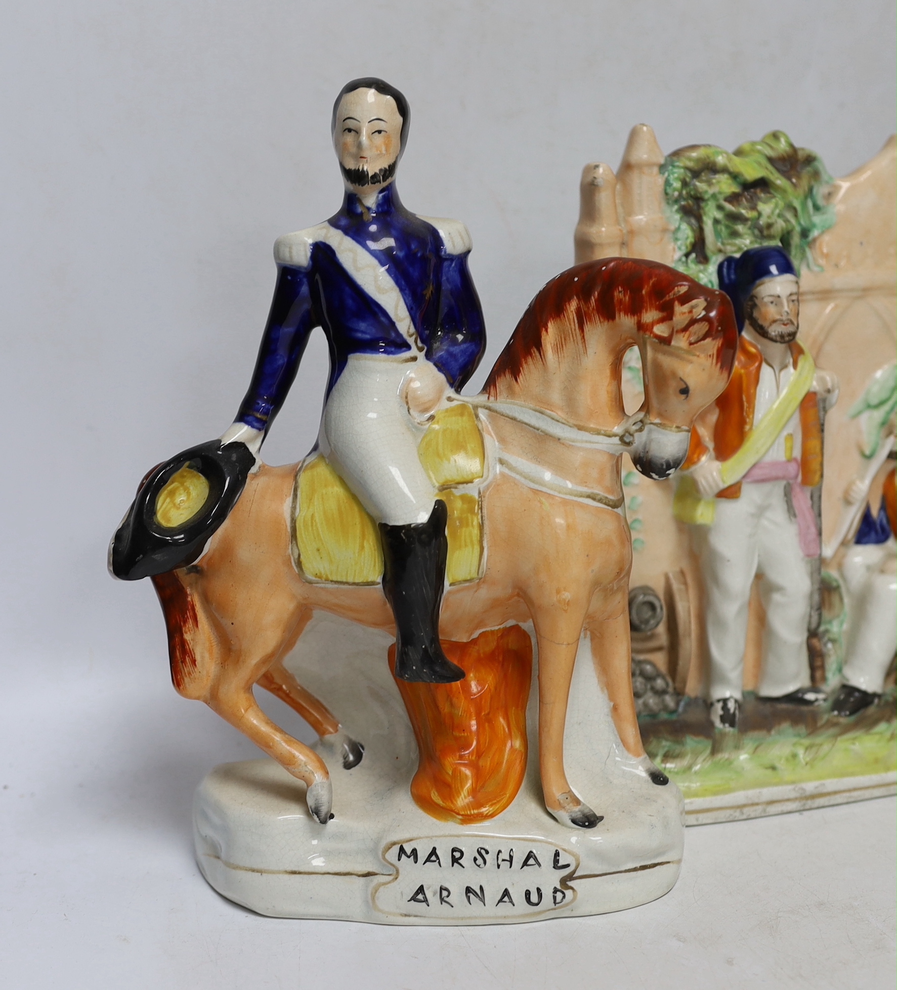 Three mid 19th century Staffordshire figure groups including Lord Raglan and Marshal Arnaud and Turkish soldiers, tallest 26.5cm